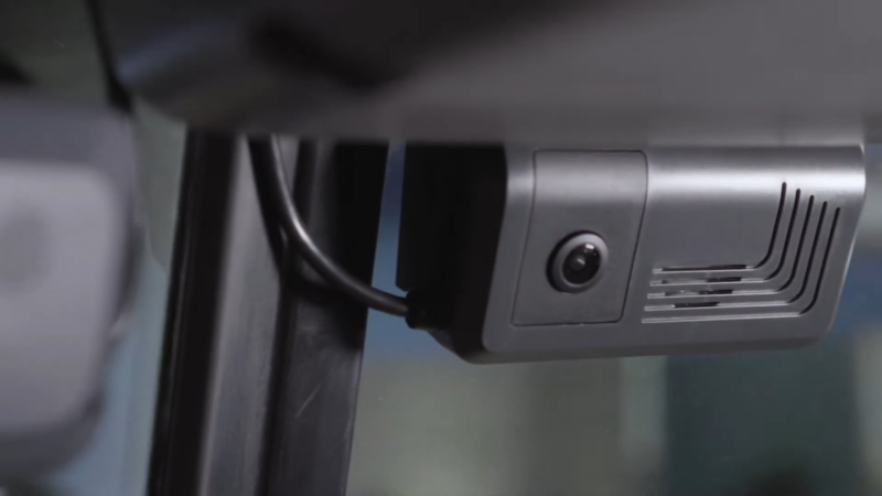 A Close-Up Image of A Vehicle's Telematics Device with A Camera and Ventilation Slots, Mounted Near the Windshield, Illustrating how Telematics and GPS Data Can Support Legal Claims