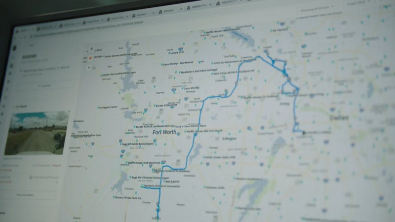 A Computer Screen Displaying a Digital Map with A Blue Route Line and Various Location Markers, Highlighting the Use of Telematics and GPS Data for Tracking and Managing Trucking Routes in The Future